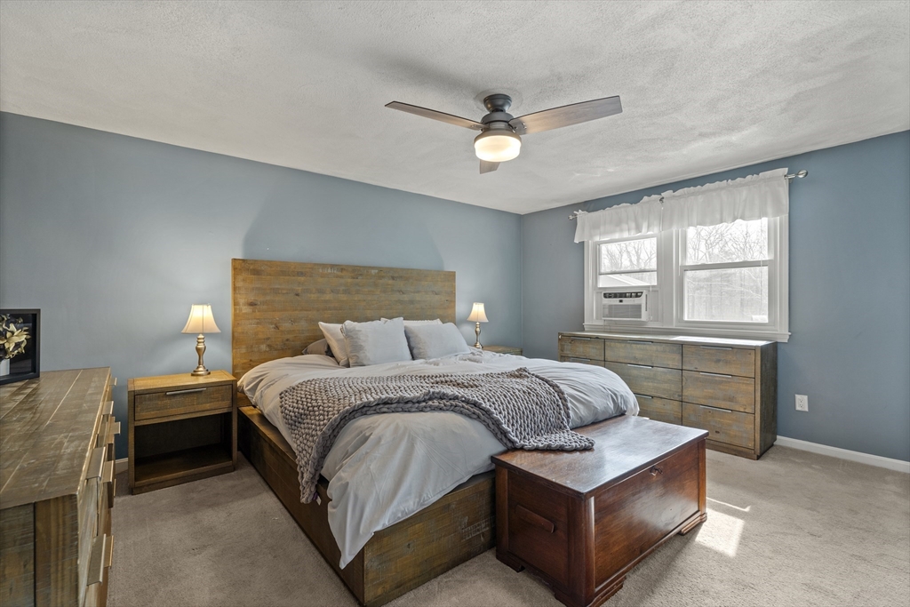 27 Leo's Lane Avon, MA 02322 - Photo 15 of 30 a bedroom with a bed and window