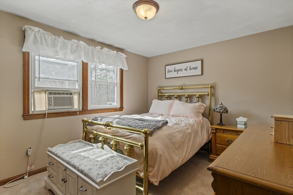 27 Leo's Lane Avon, MA 02322 - Photo 17 of 30 a bedroom with a bed and window