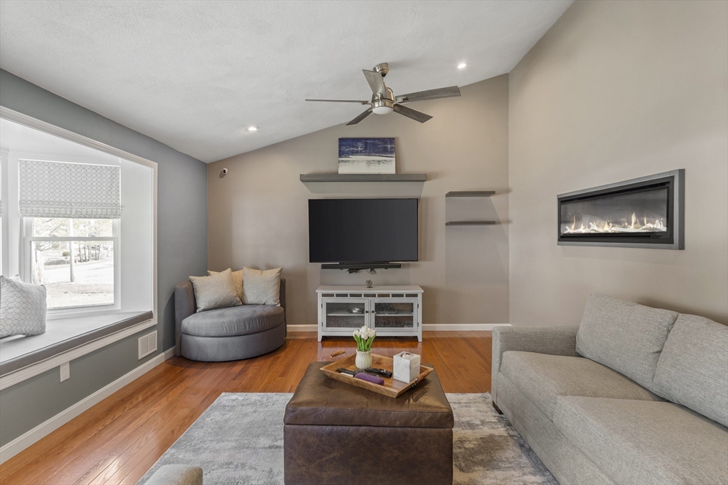 27 Leo's Lane Avon, MA 02322 - Photo 7 of 30 a living room with furniture and a flat screen tv