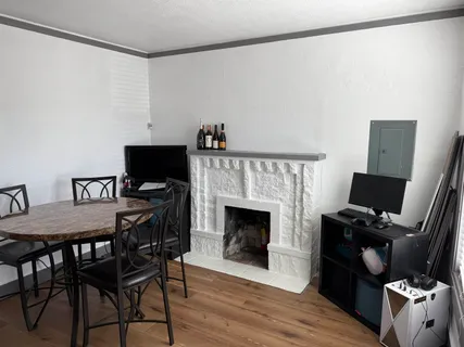 a view of a livingroom with furniture and a fireplace