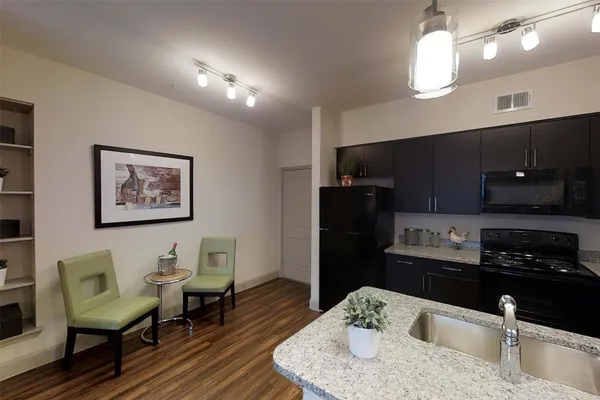 a kitchen with a table and chairs in it