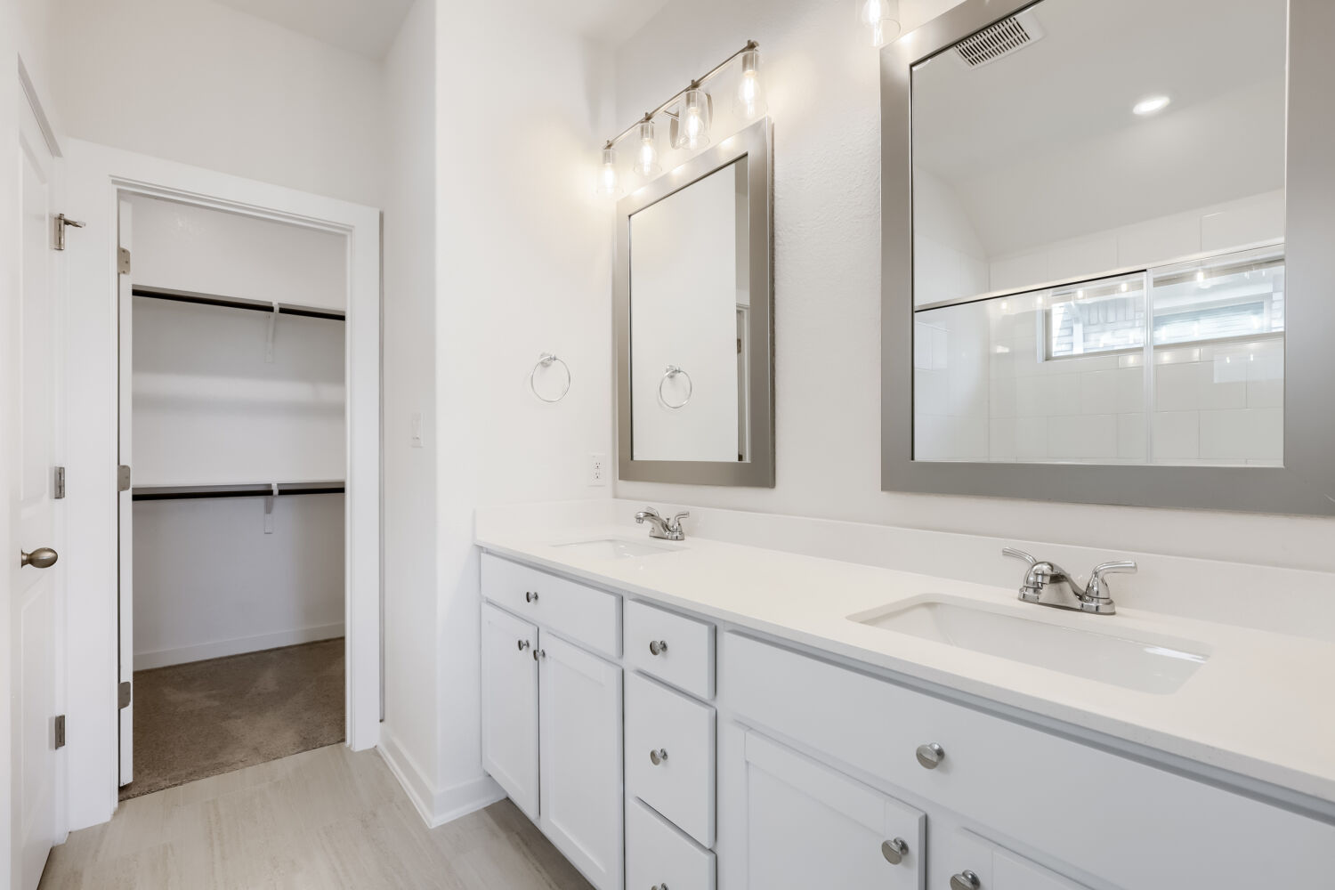 356 Brandywine Road Hutto, TX 78634 - Photo 7 of 11 A pristine bathroom features a double vanity and a nearby walk-in closet.