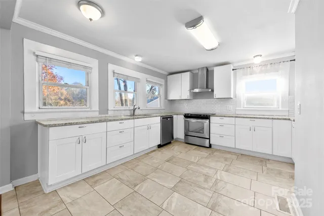 a kitchen with cabinets and window