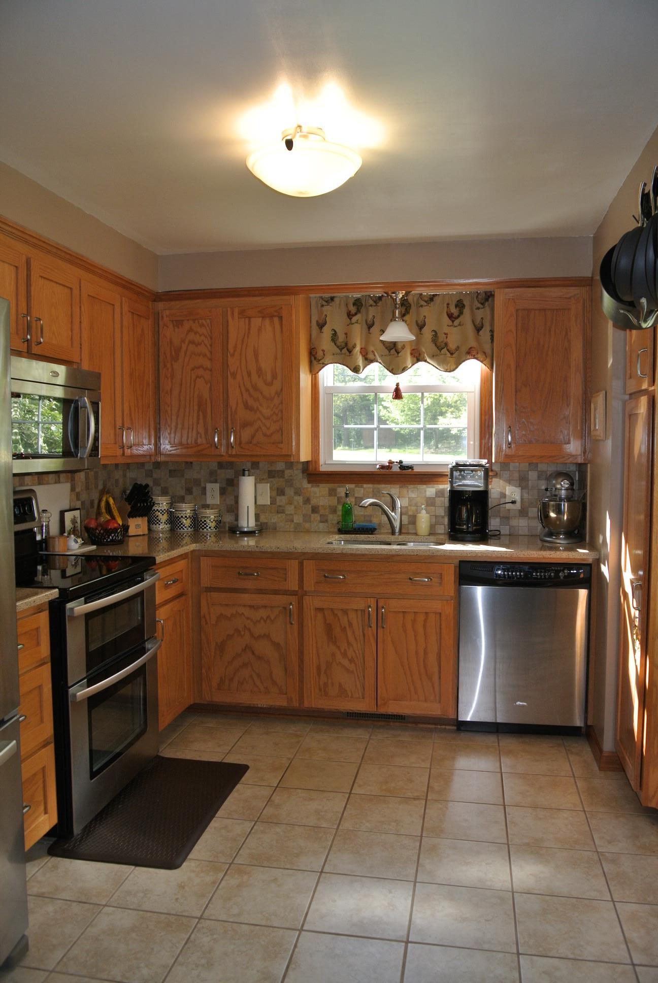 308 Dean Road Clarksville, TN 37040 - Photo 4 of 18 a kitchen with a sink window and stainless steel appliances