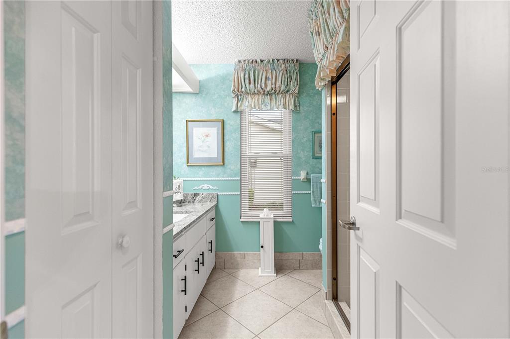 8145 Southwest 109th Street Ocala, FL 34481 - Photo 14 of 43 a bathroom with a bathtub and a shower