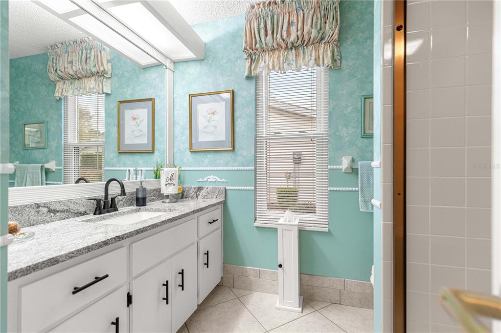 8145 Southwest 109th Street Ocala, FL 34481 - Photo 15 of 43 a bathroom with a sink and a mirror