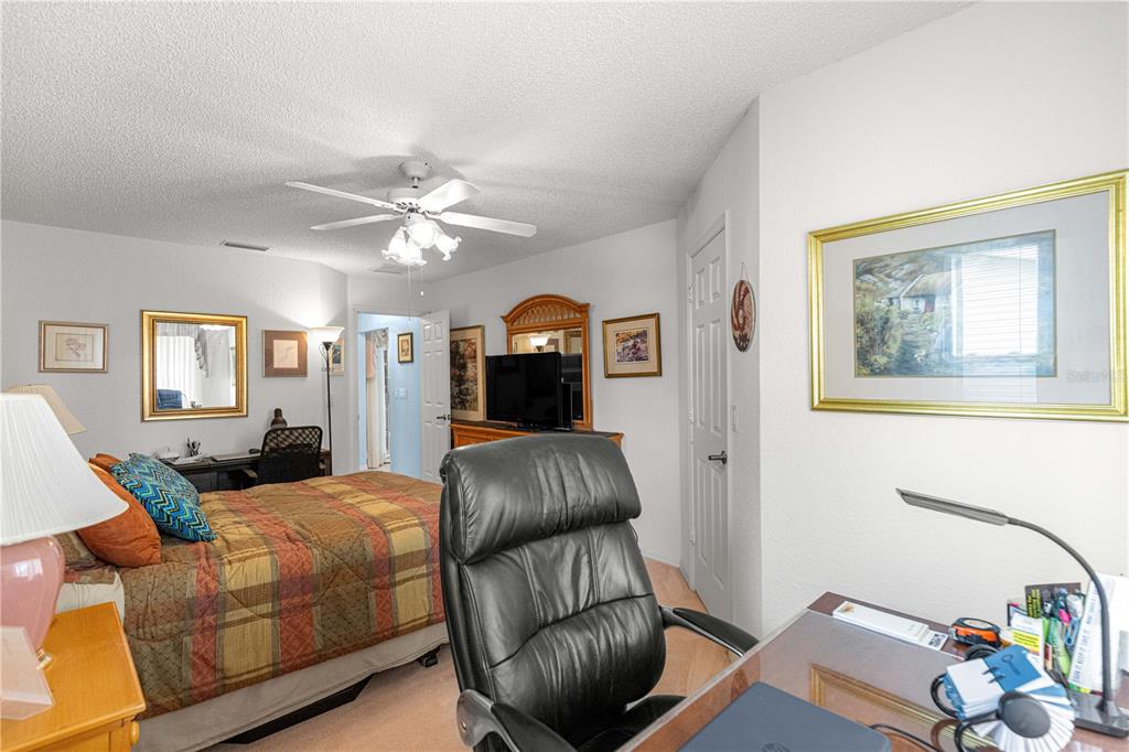 8145 Southwest 109th Street Ocala, FL 34481 - Photo 20 of 43 a living room with furniture and a chandelier