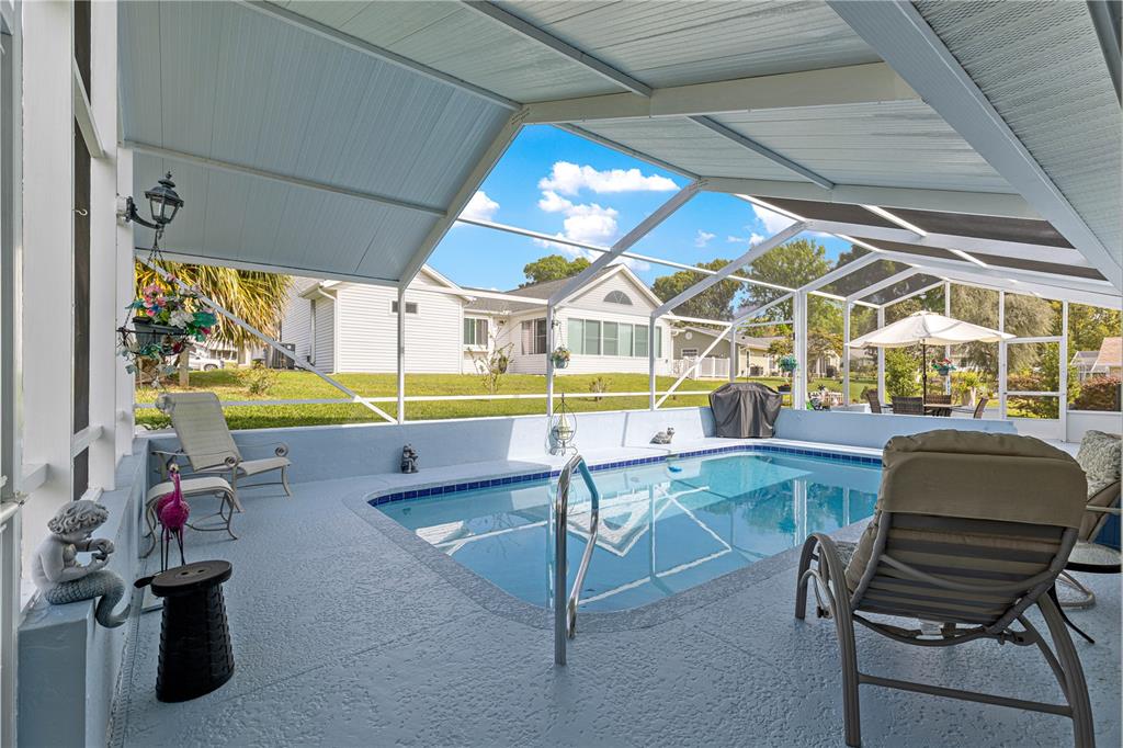 8145 Southwest 109th Street Ocala, FL 34481 - Photo 28 of 43 a view of a chairs and table in a patio