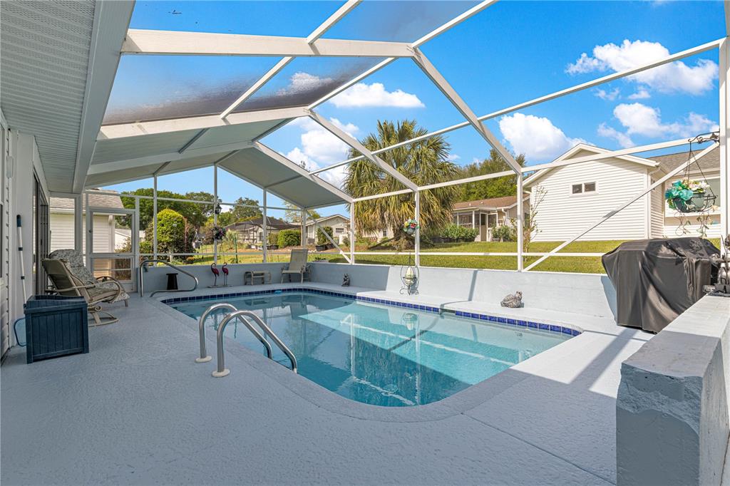 8145 Southwest 109th Street Ocala, FL 34481 - Photo 29 of 43 a view of a swimming pool with seating area