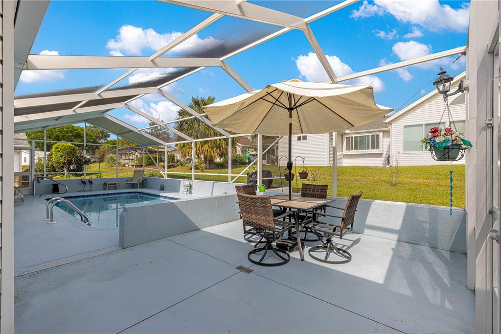 8145 Southwest 109th Street Ocala, FL 34481 - Photo 31 of 43 a view of swimming pool with outdoor seating