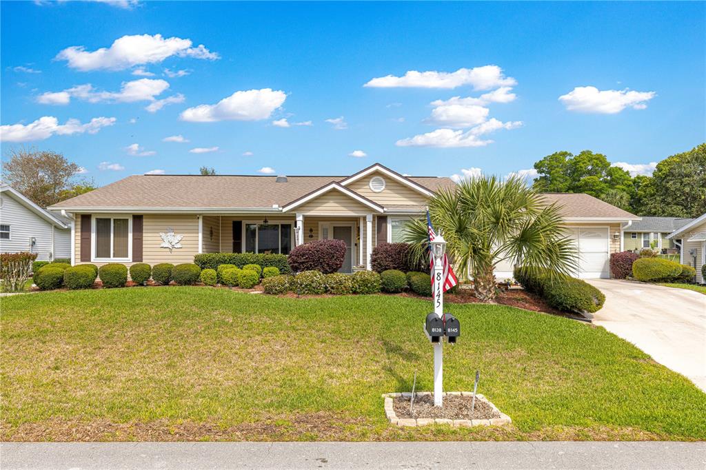 8145 Southwest 109th Street Ocala, FL 34481 - Photo 39 of 43 a front view of a house with a yard