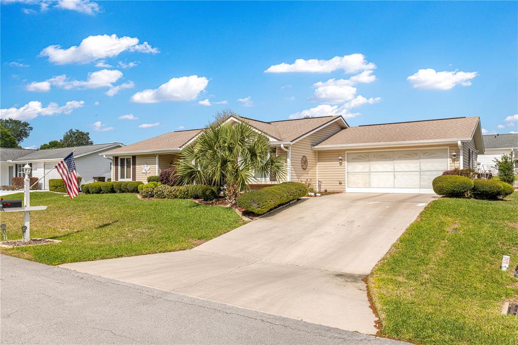 8145 Southwest 109th Street Ocala, FL 34481 - Photo 40 of 43 a front view of a house with garden