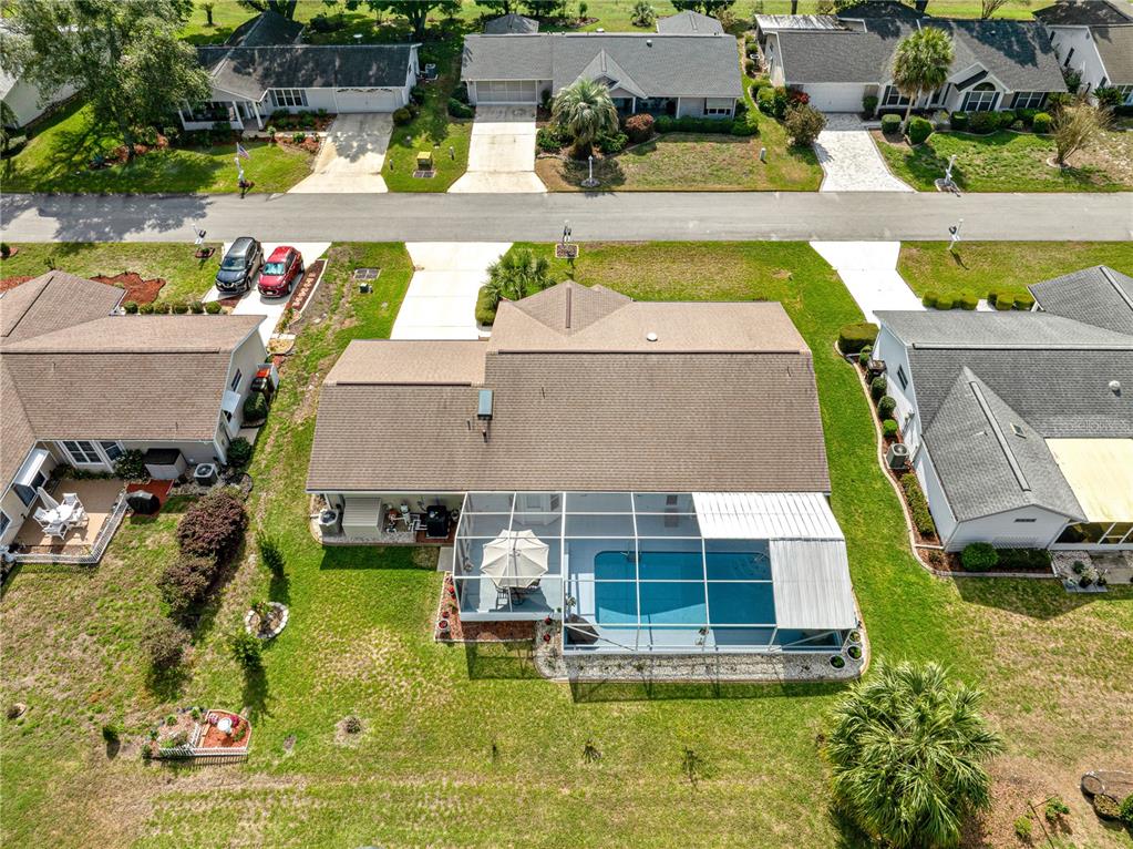 8145 Southwest 109th Street Ocala, FL 34481 - Photo 42 of 43 an aerial view of a house with swimming pool and outdoor seating