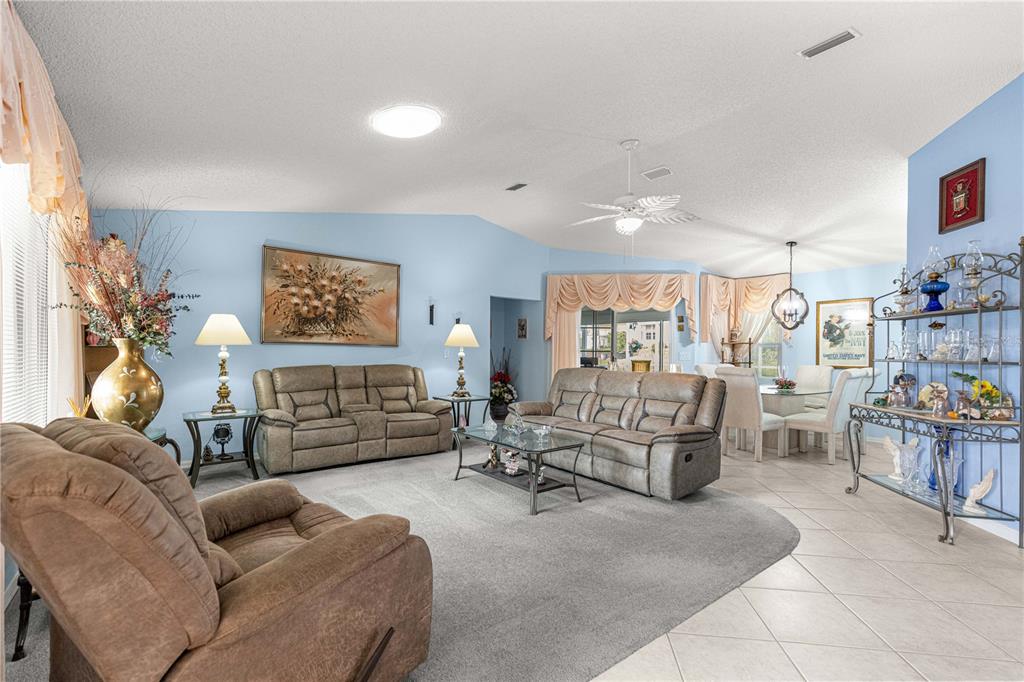 8145 Southwest 109th Street Ocala, FL 34481 - Photo 7 of 43 a living room with furniture and a fireplace