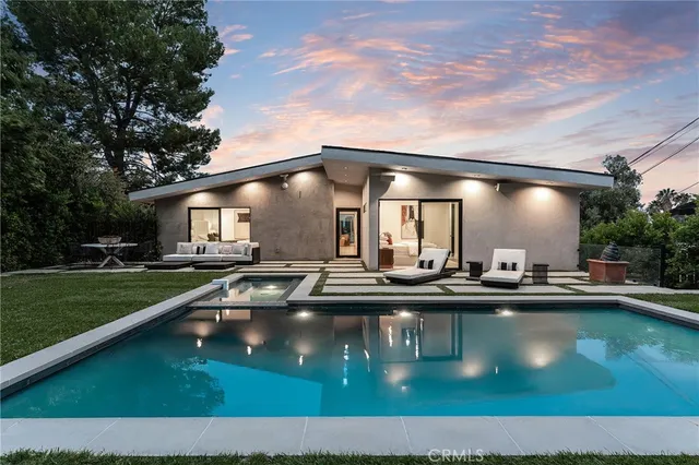 a view of swimming pool having outdoor seating