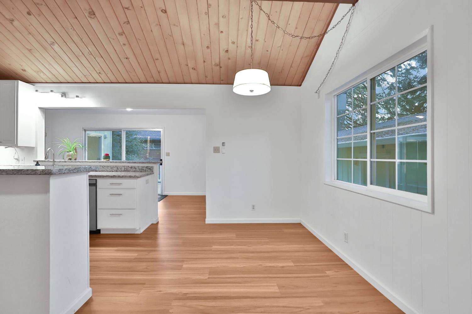 3060 Leaf Circle Pollock Pines, CA 95726 - Photo 11 of 38 an empty room with wooden floor and windows