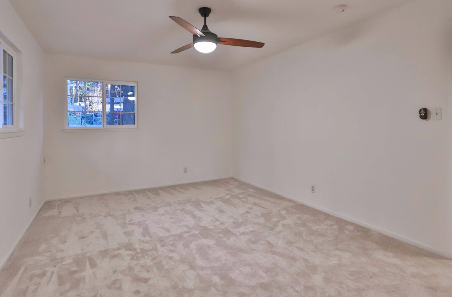 3060 Leaf Circle Pollock Pines, CA 95726 - Photo 27 of 38 an empty room with a ceiling fan and window