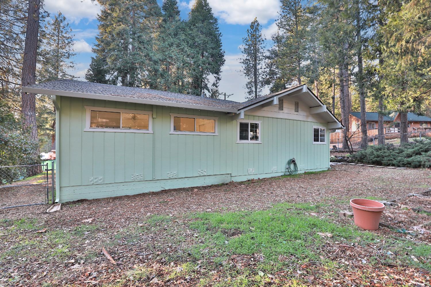 3060 Leaf Circle Pollock Pines, CA 95726 - Photo 30 of 38 a backyard of a house with lots of green space