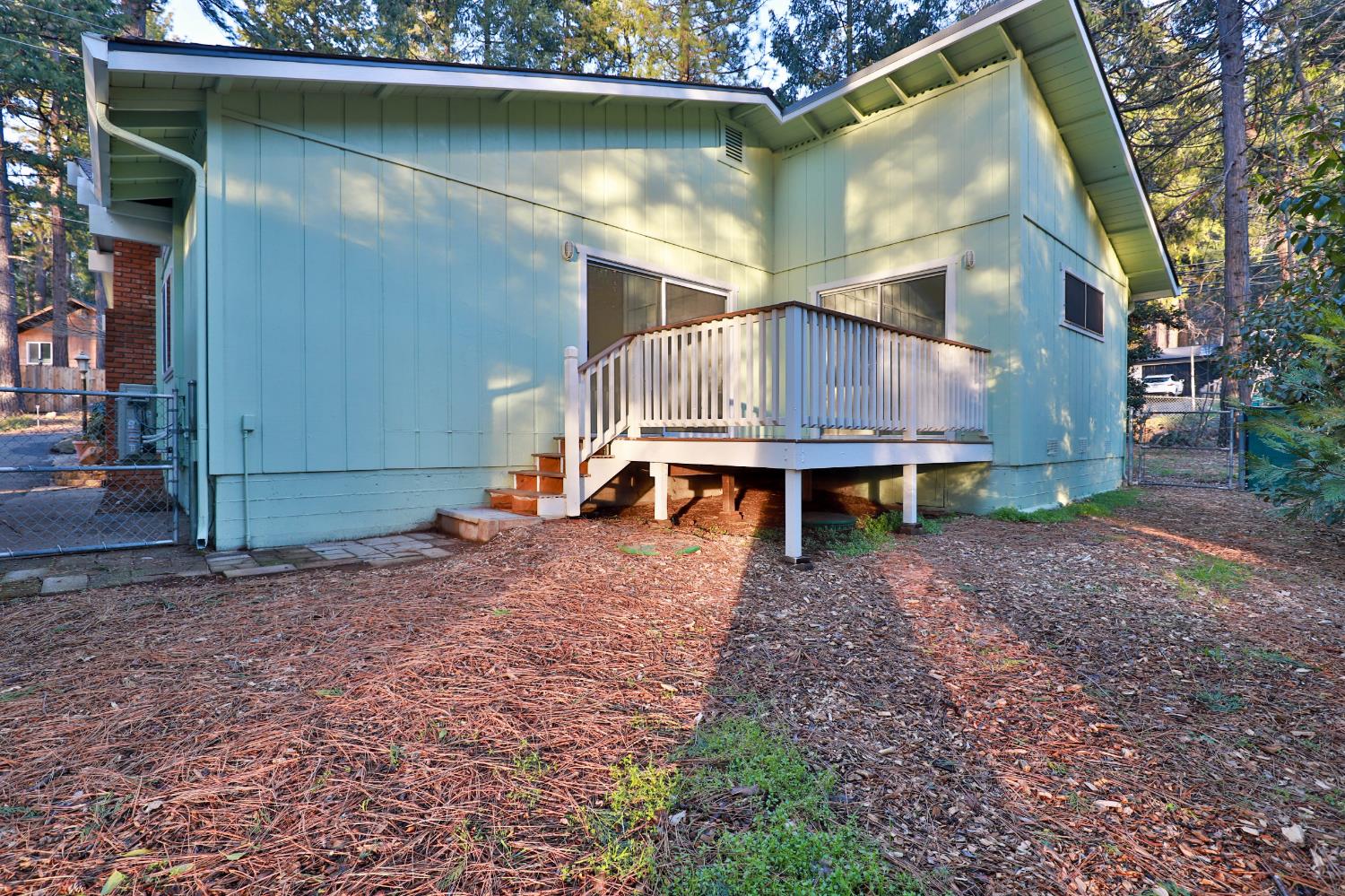 3060 Leaf Circle Pollock Pines, CA 95726 - Photo 32 of 38 a house with a trees in the background