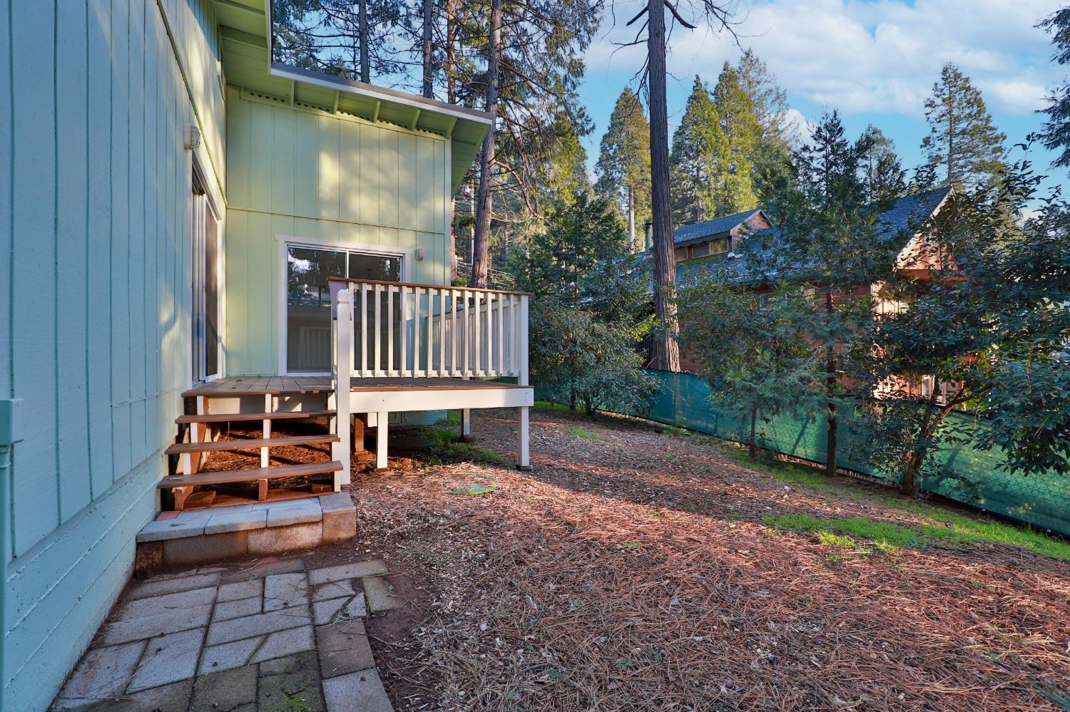 3060 Leaf Circle Pollock Pines, CA 95726 - Photo 33 of 38 a view of a house with backyard and wooden fence