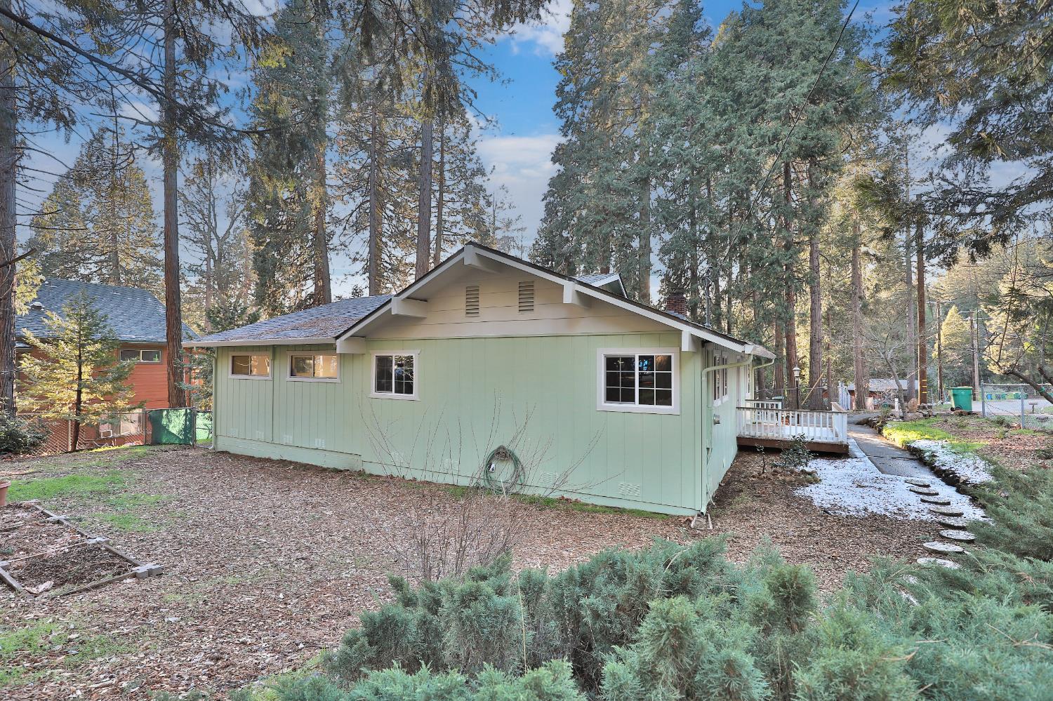 3060 Leaf Circle Pollock Pines, CA 95726 - Photo 37 of 38 a view of a house with a yard and large trees