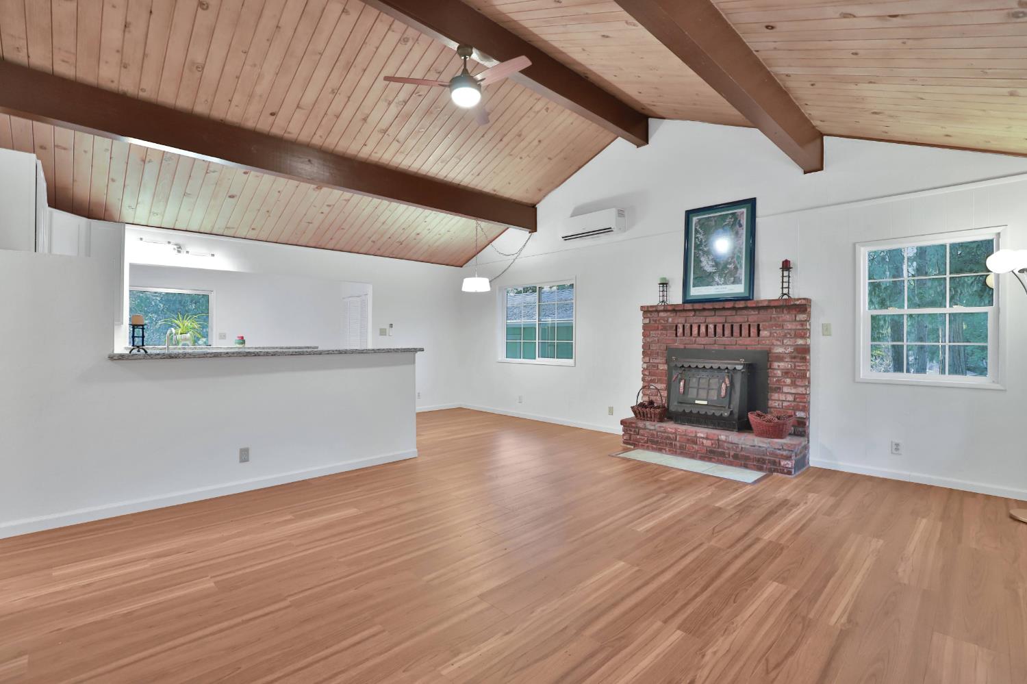 3060 Leaf Circle Pollock Pines, CA 95726 - Photo 4 of 38 a view of empty room with wooden floor and fireplace