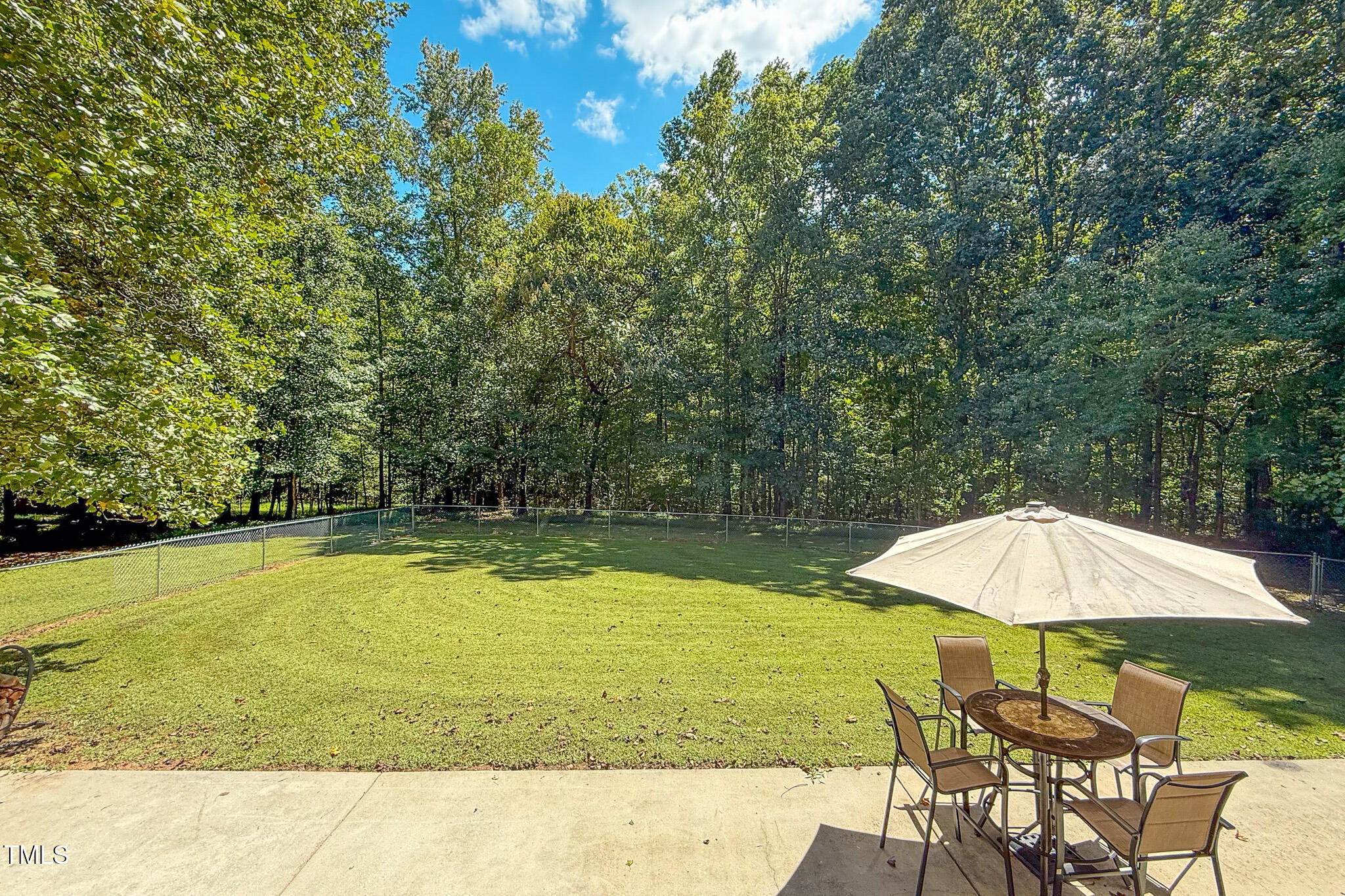 576 Duncan Road Timberlake, NC 27583 - Photo 11 of 91 a view of a swimming pool with chair and umbrella