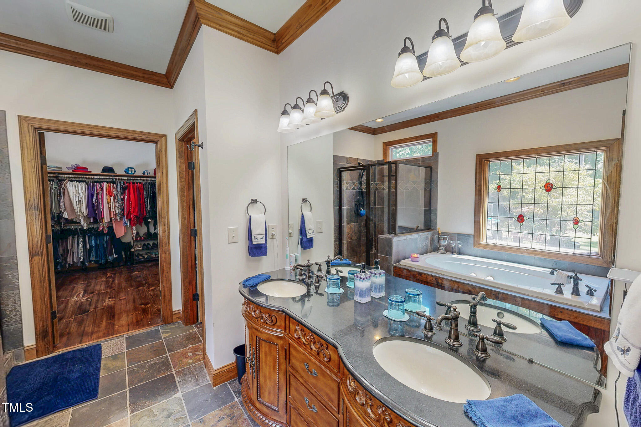 576 Duncan Road Timberlake, NC 27583 - Photo 25 of 91 a bathroom with a sink double vanity and a mirror