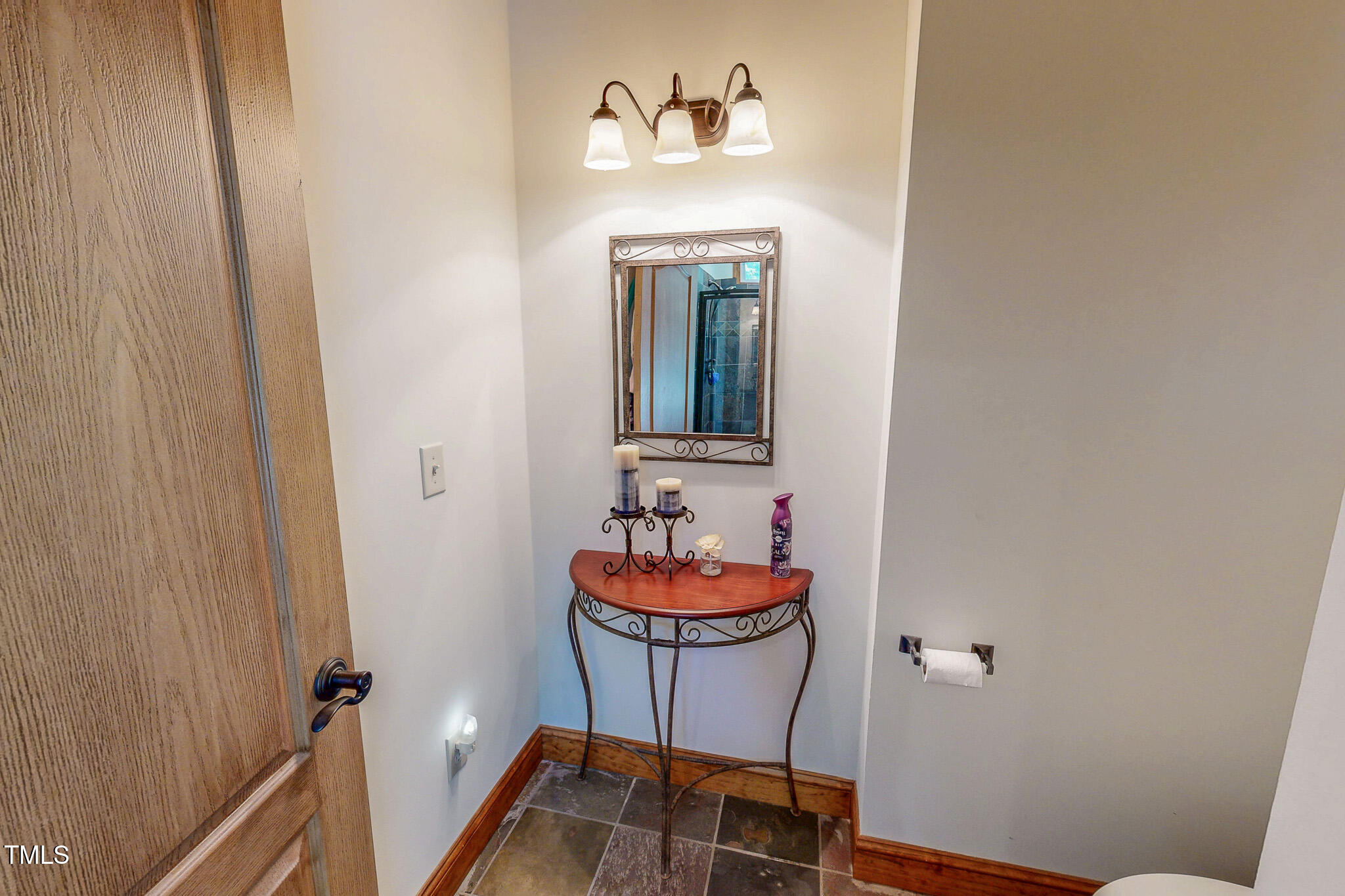 576 Duncan Road Timberlake, NC 27583 - Photo 29 of 91 a bathroom with a sink and a mirror