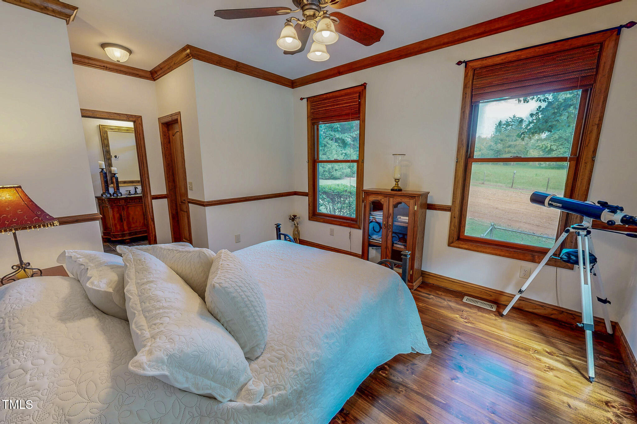 576 Duncan Road Timberlake, NC 27583 - Photo 37 of 91 a bed room with a bed and a chandelier