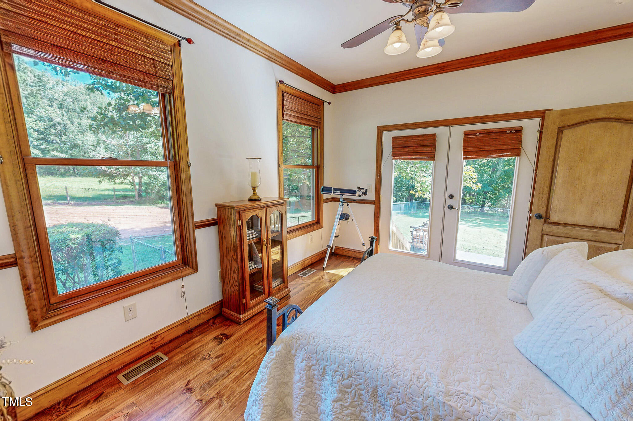 576 Duncan Road Timberlake, NC 27583 - Photo 40 of 91 a bed room with a bed and a large window