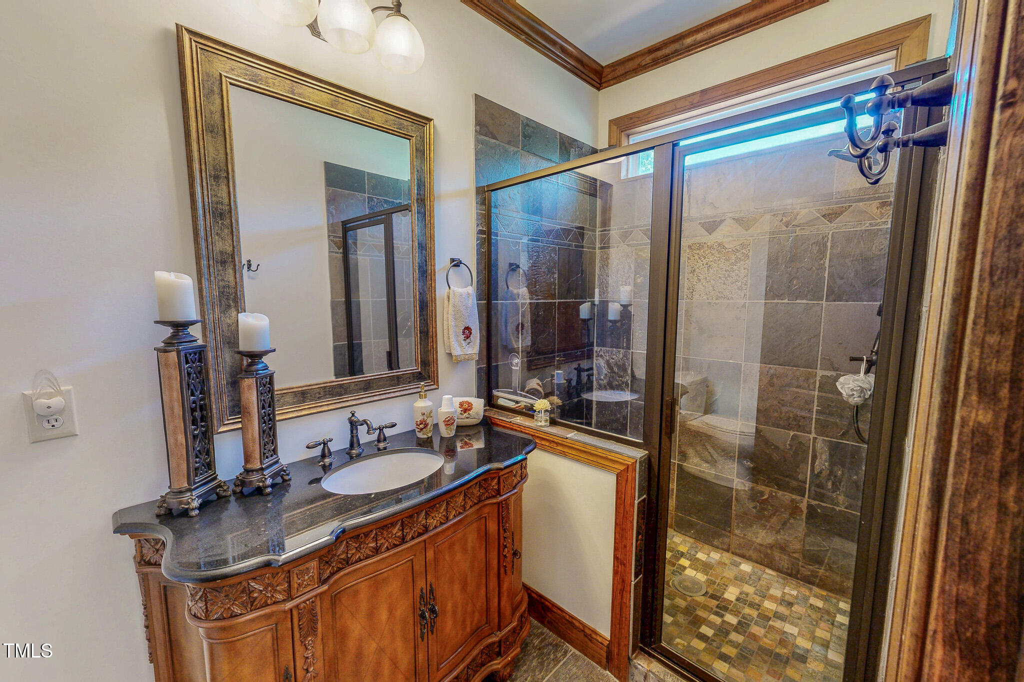 576 Duncan Road Timberlake, NC 27583 - Photo 42 of 91 a bathroom with a sink a mirror and a shower