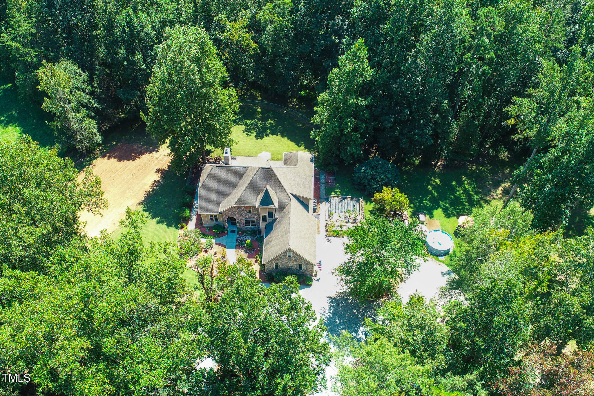 576 Duncan Road Timberlake, NC 27583 - Photo 44 of 91 an aerial view of a house with a yard and trees all around