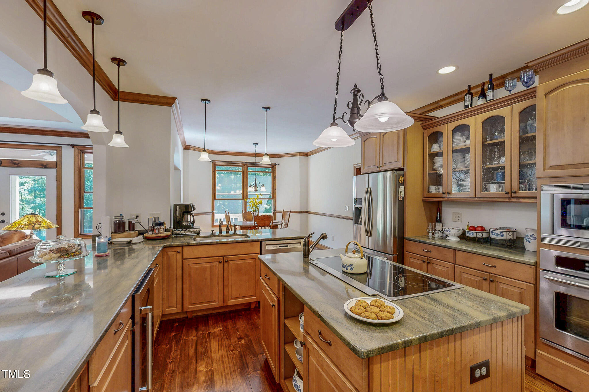 576 Duncan Road Timberlake, NC 27583 - Photo 59 of 91 a kitchen with sink refrigerator and stove