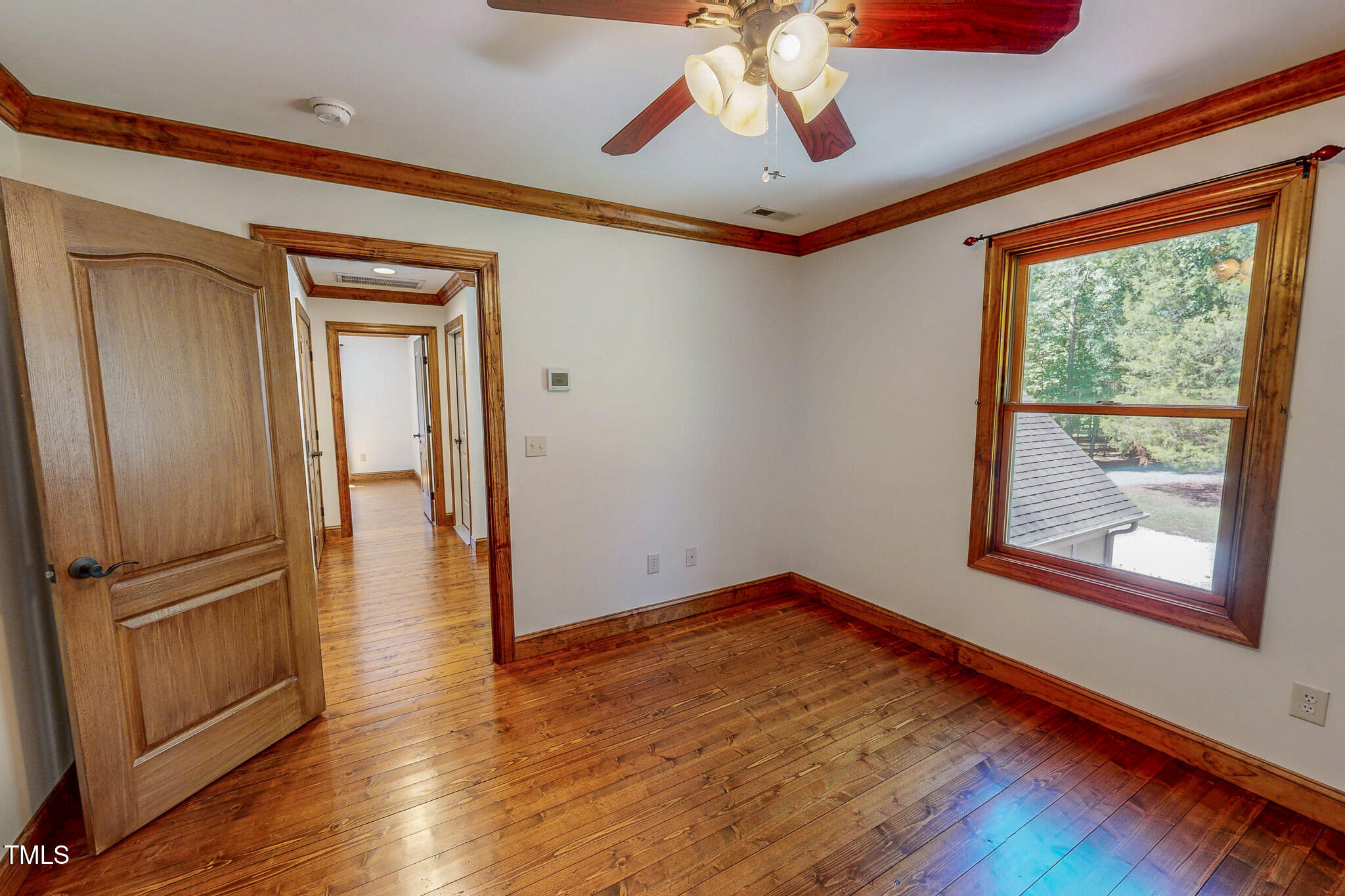 576 Duncan Road Timberlake, NC 27583 - Photo 70 of 91 a view of empty room with wooden floor and fan