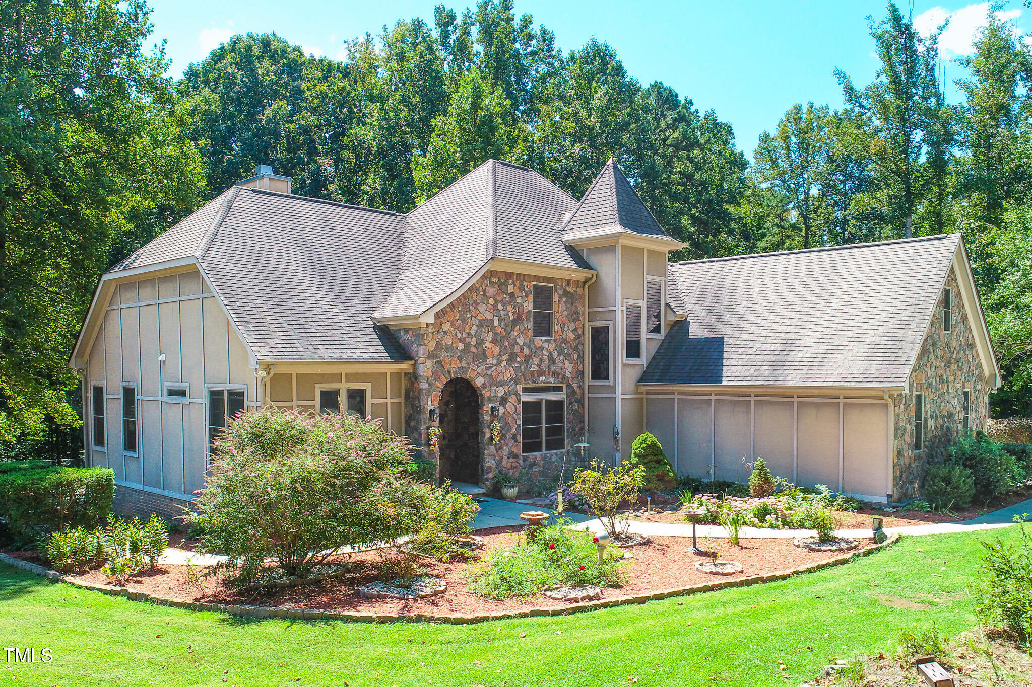 576 Duncan Road Timberlake, NC 27583 - Photo 7 of 91 a front view of a house with a yard table and garage