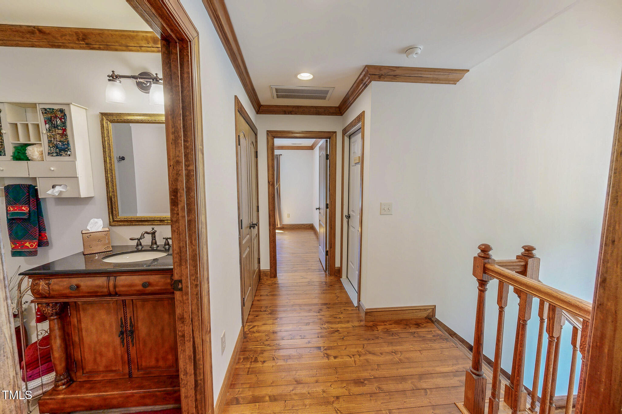 576 Duncan Road Timberlake, NC 27583 - Photo 72 of 91 a view of a hallway with wooden floor and staircase