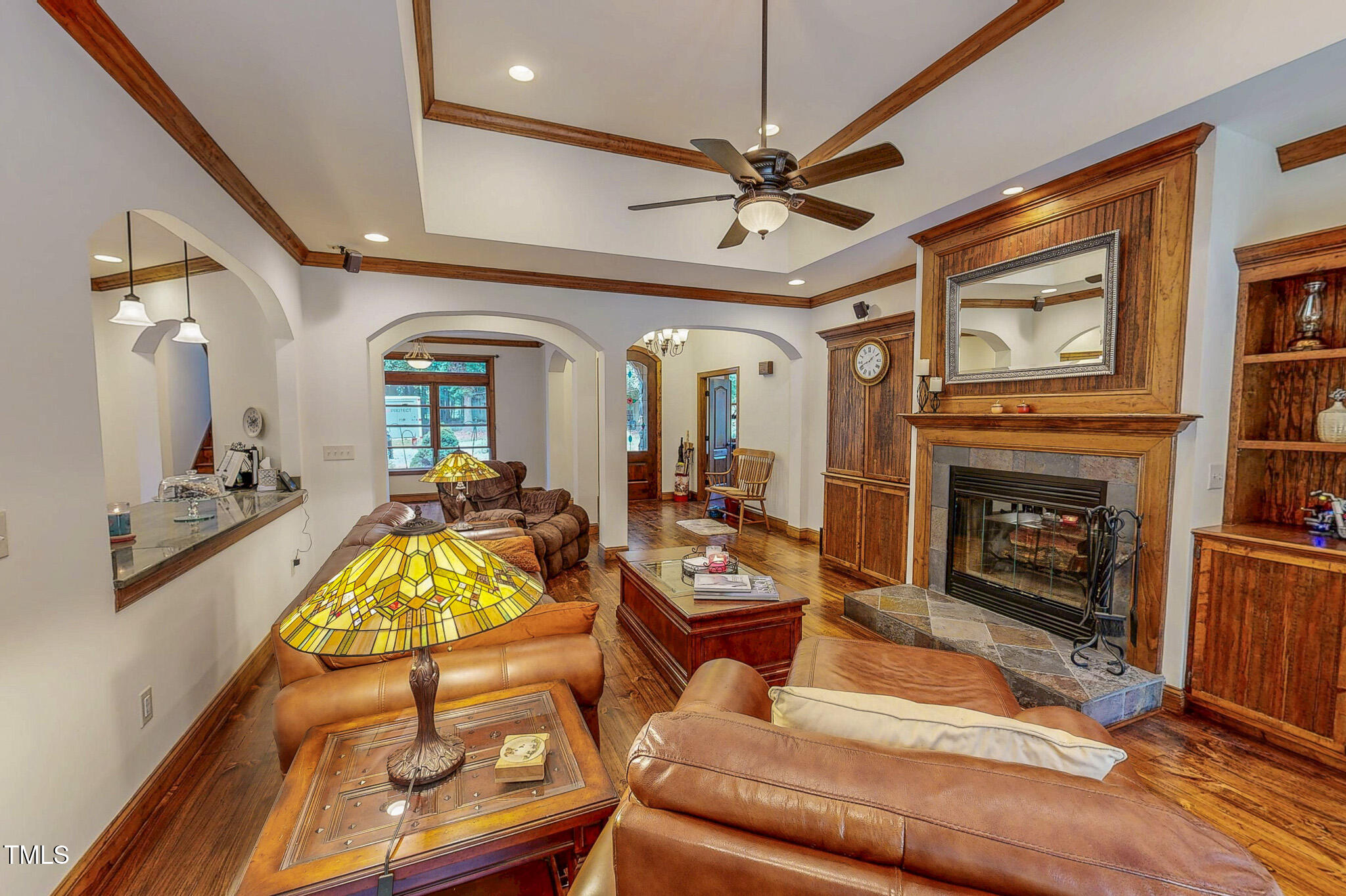 576 Duncan Road Timberlake, NC 27583 - Photo 75 of 91 a living room with furniture a flat screen tv and a fireplace