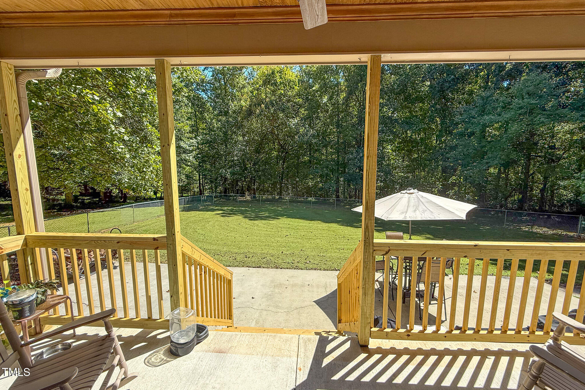 576 Duncan Road Timberlake, NC 27583 - Photo 10 of 91 a view of a balcony with floor to ceiling windows yard and outdoor view