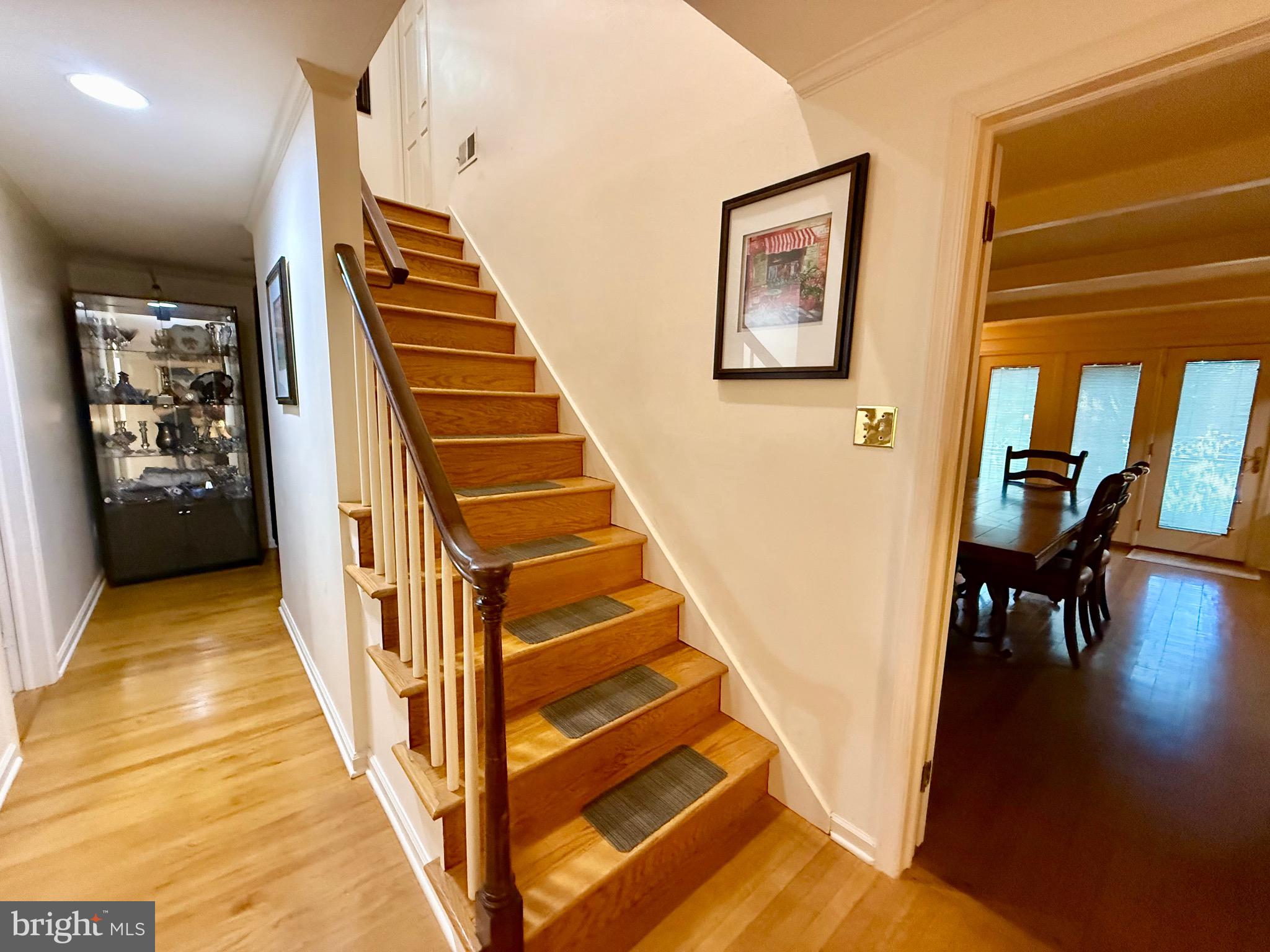 110 Partree Road Cherry Hill, NJ 08003 - Photo 11 of 33 a view of a hallway with wooden floor and stairs