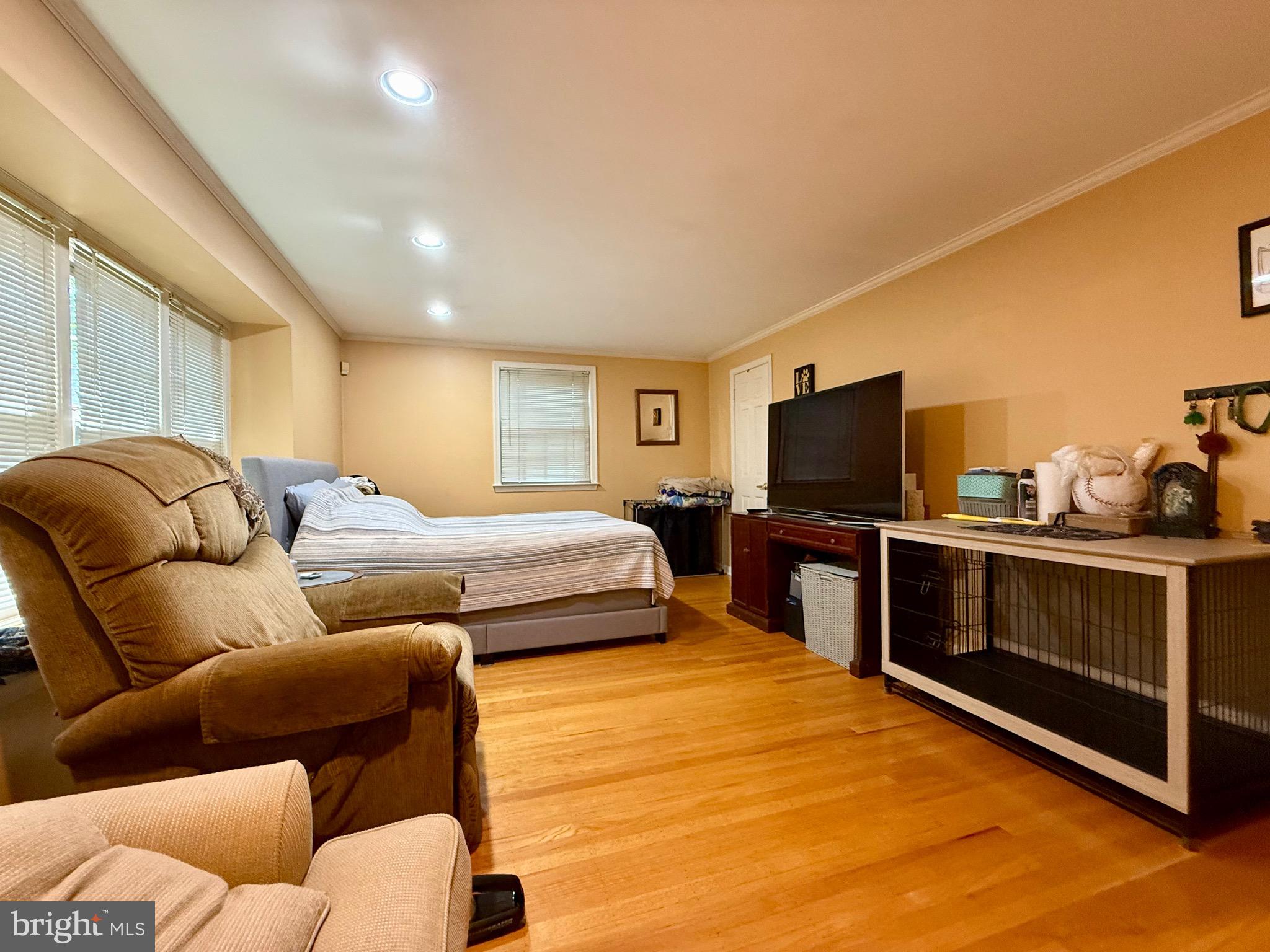 110 Partree Road Cherry Hill, NJ 08003 - Photo 14 of 33 a bedroom with furniture and a flat screen tv