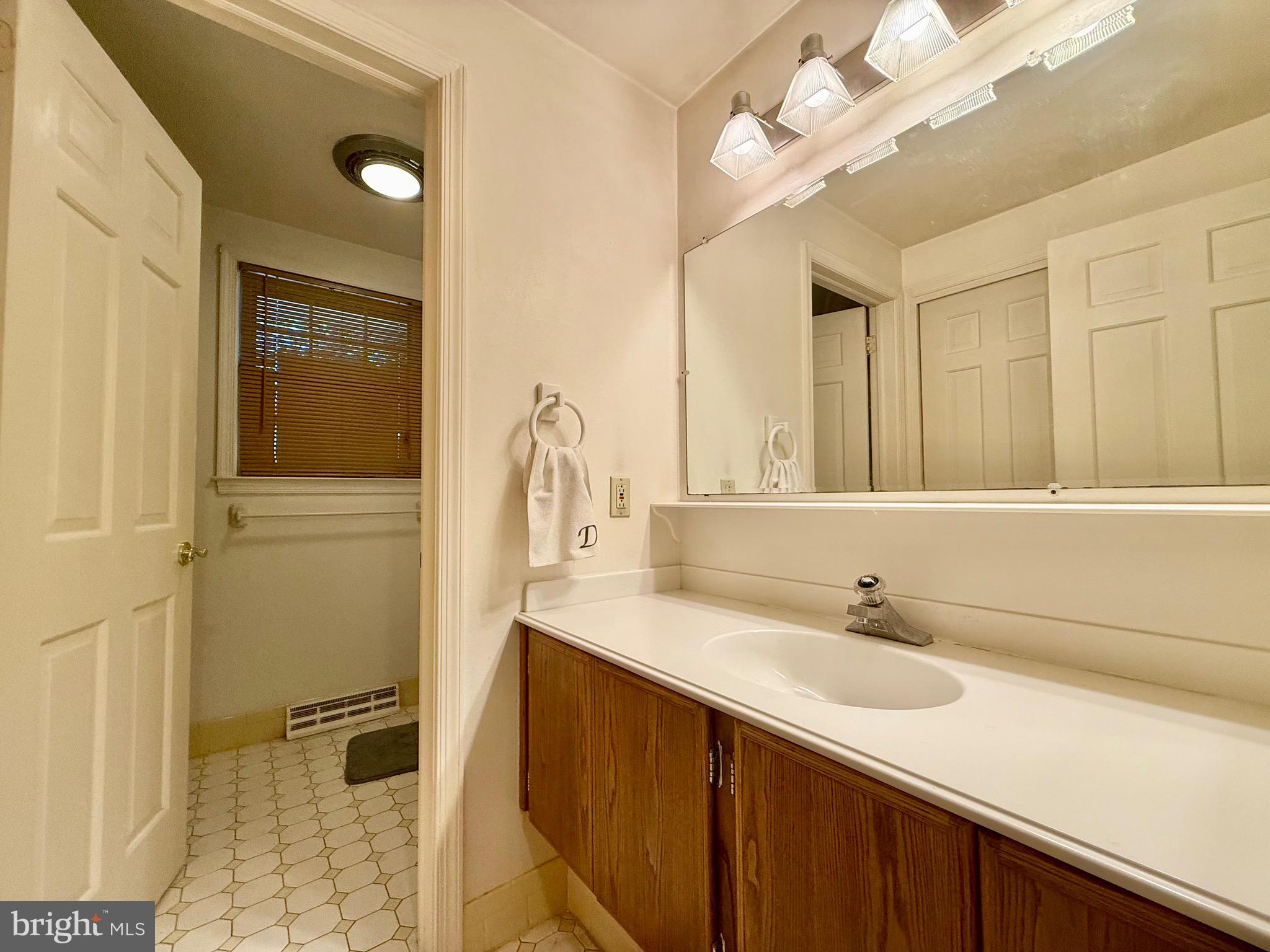 110 Partree Road Cherry Hill, NJ 08003 - Photo 19 of 33 a bathroom with a sink vanity and a mirror
