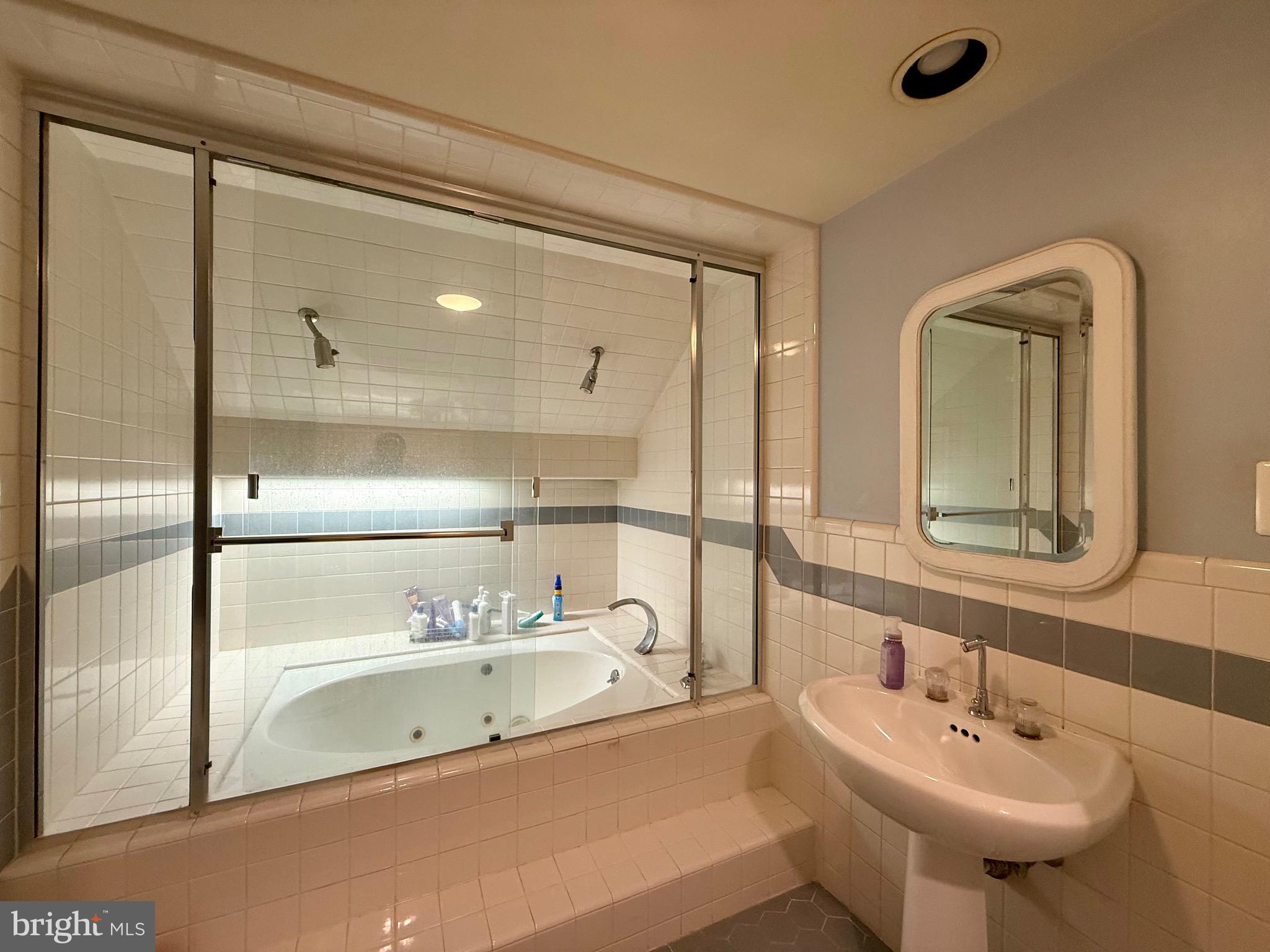 110 Partree Road Cherry Hill, NJ 08003 - Photo 23 of 33 a bathroom with a tub sink and mirror