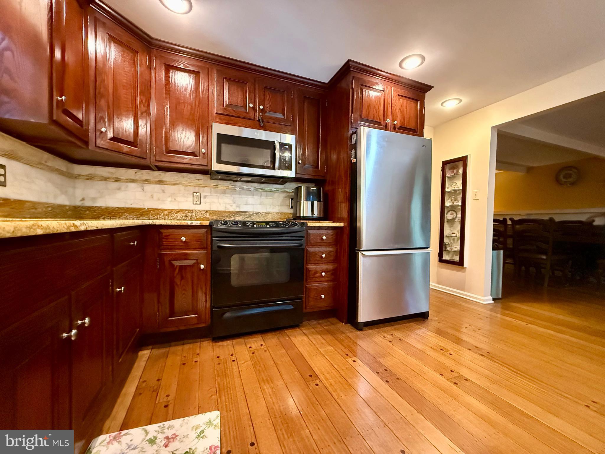 110 Partree Road Cherry Hill, NJ 08003 - Photo 5 of 33 a kitchen with stainless steel appliances granite countertop a refrigerator a stove a sink and dishwasher