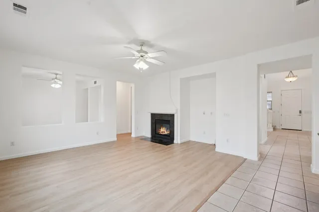 a large kitchen with kitchen island a sink stainless steel appliances and cabinets