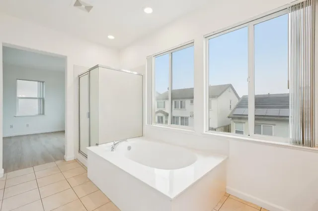 a view of a lake with lawn chairs