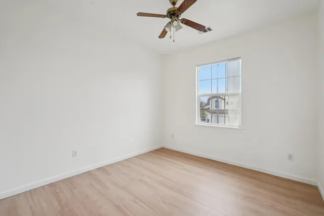 an aerial view of residential houses with outdoor space and swimming pool