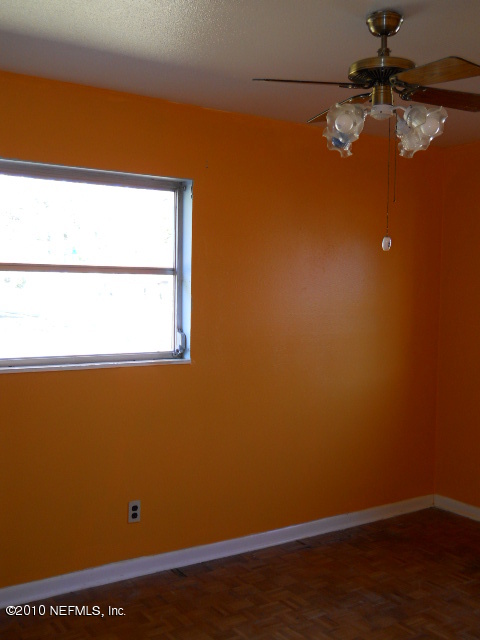 4005 Dayrl Road Jacksonville, FL 32207 - Photo 8 of 14 a view of a small space with wooden floor and a window