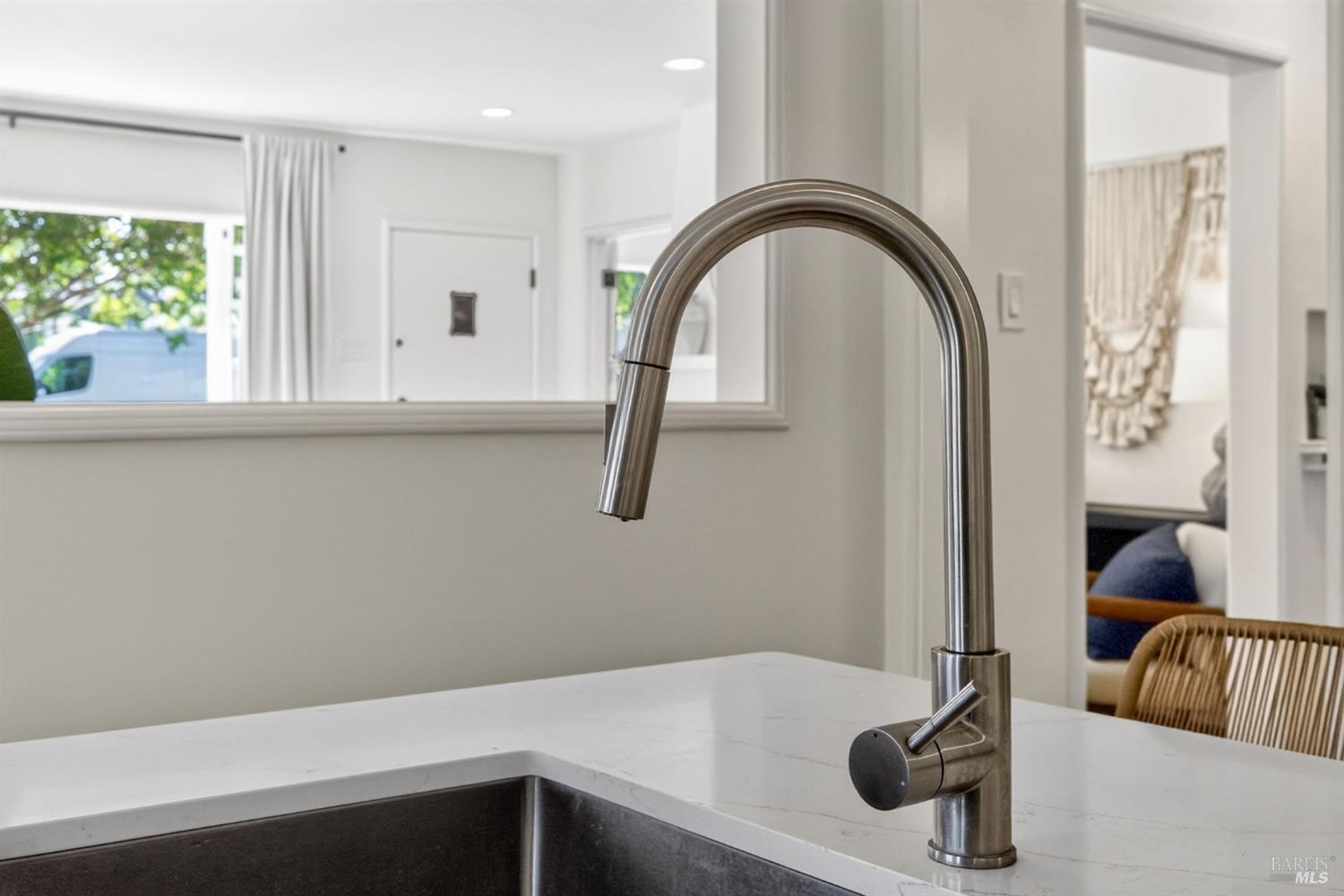 2211 Humboldt Street Santa Rosa, CA 95404 - Photo 19 of 52 a close view of a sink and a faucet in a kitchen with a window