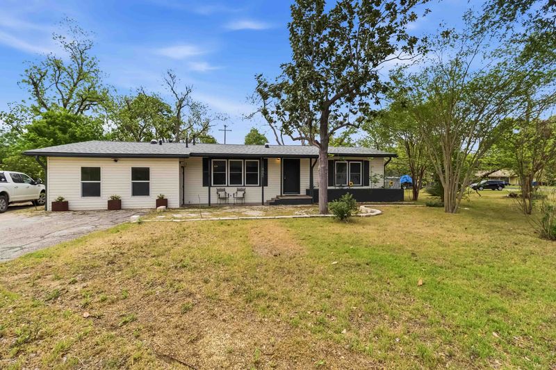 Ranch-style home with a front yard